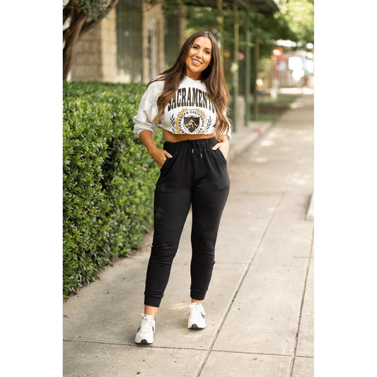 Women’s fleece-lined black joggers winter loungewear Soft black joggers with tapered leg and drawstring waist
