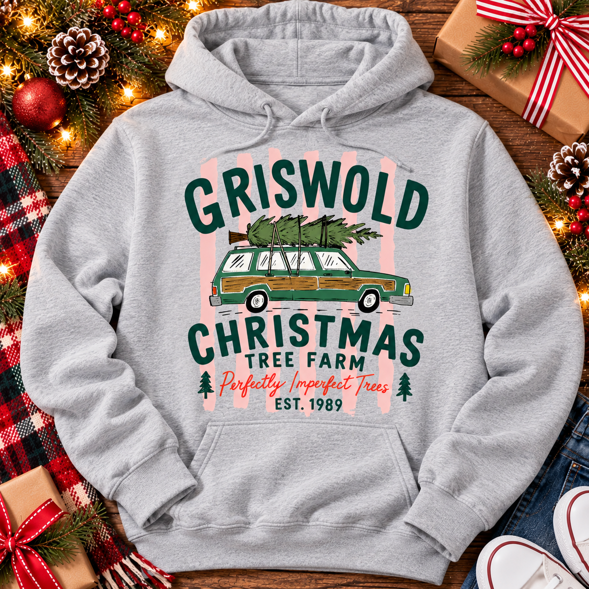 Christmas graphic tee featuring Griswold Christmas Tree Farm vintage green station wagon with Christmas tree and retro lettering.