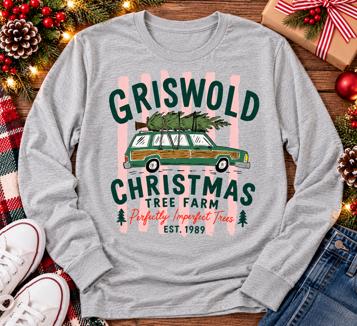 Christmas graphic tee featuring Griswold Christmas Tree Farm vintage green station wagon with Christmas tree and retro lettering.